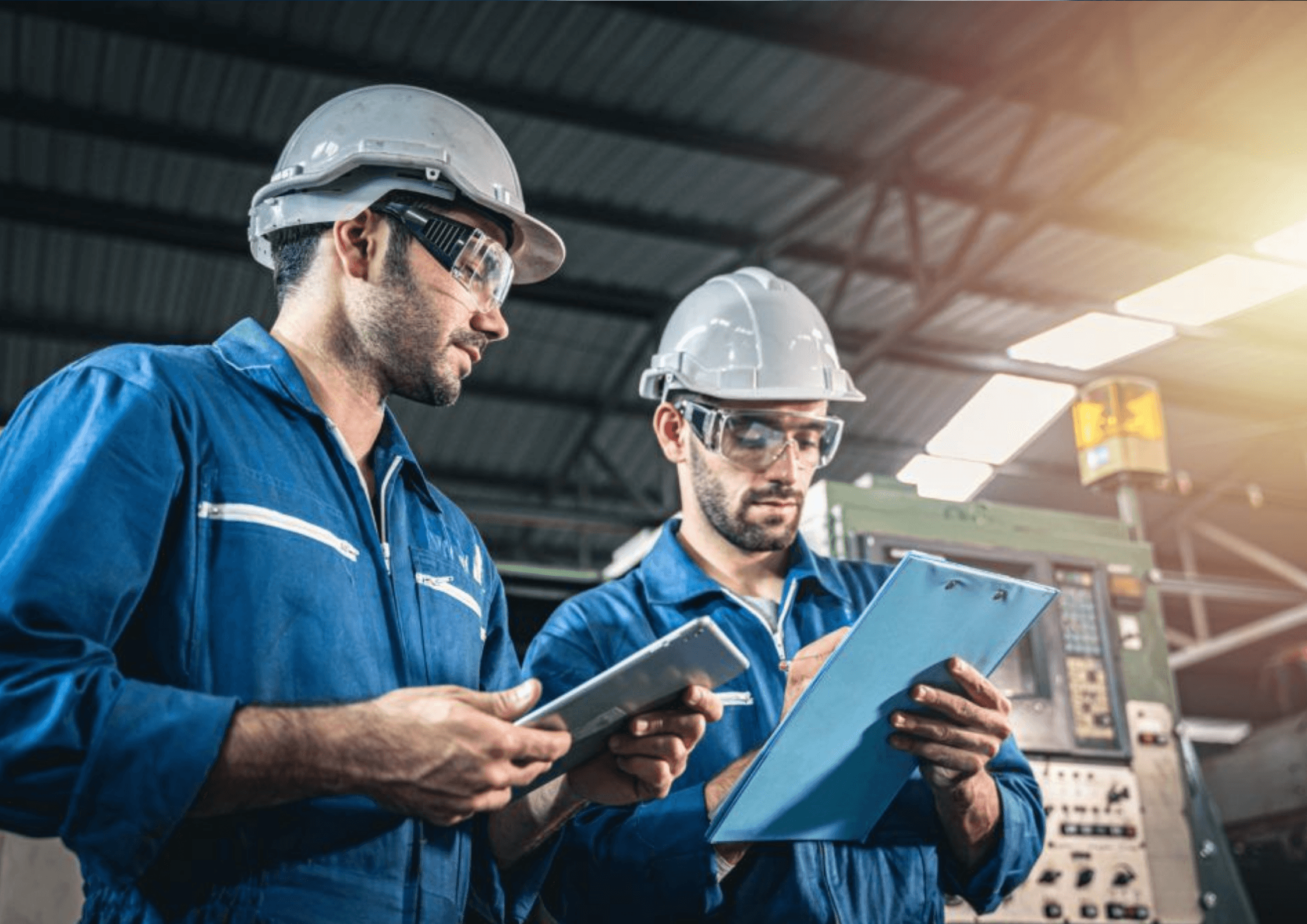 Industrial engineers reviewing installation and commissioning work